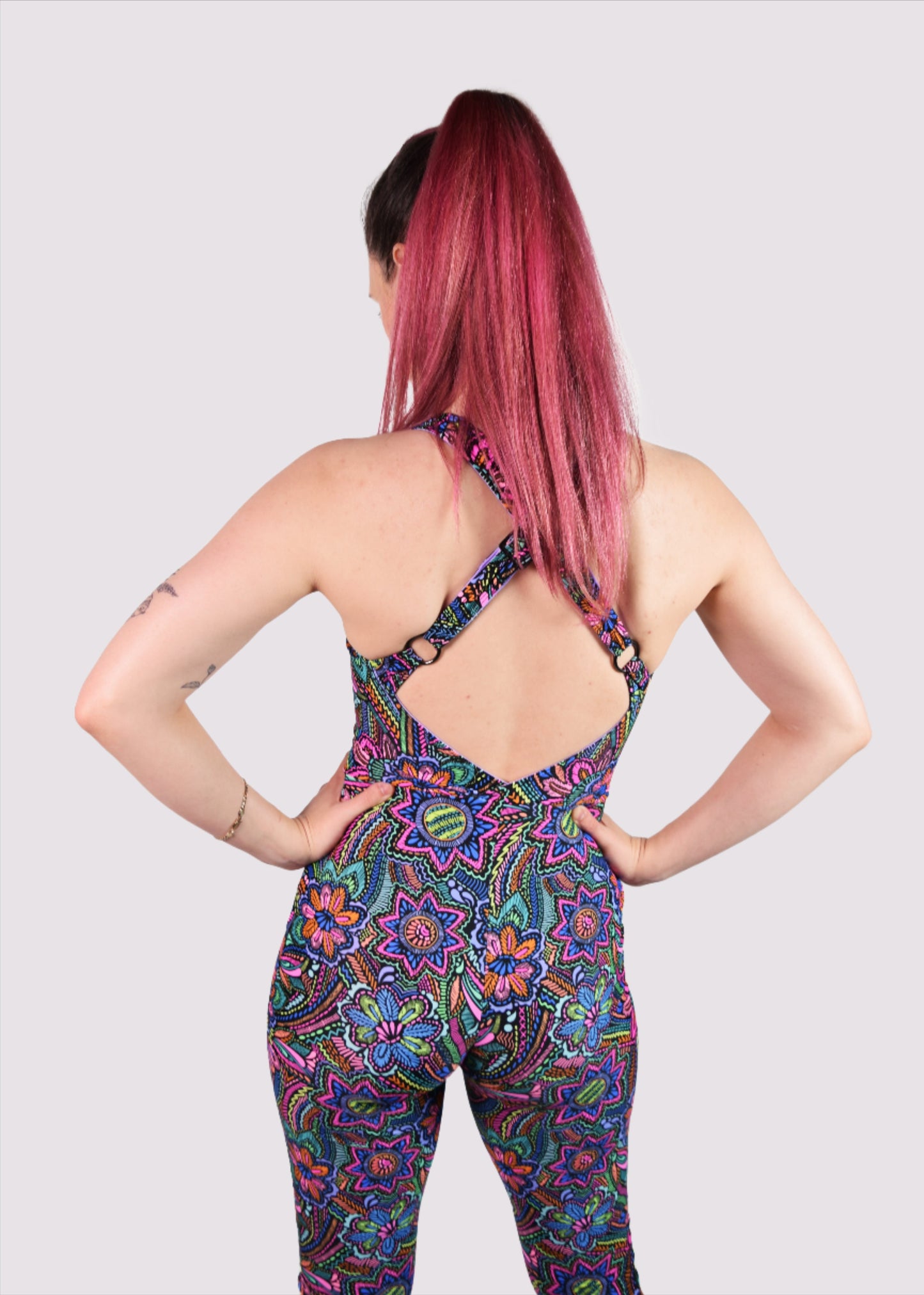 Womens music fesival fashion - Festival-outfit-rave-outfit - handmade-in-Brooklyn-New York City-custom made-waste conscious– retro style – hippie fashion –rave bralette top – festival jumpsuit - sleevless– retro style – supportive x back – adjustable straps - back view - on model