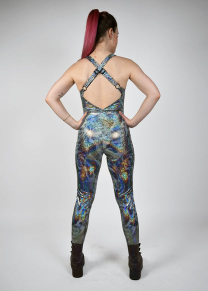 Womens music fesival fashion - Festival-outfit-rave-outfit - handmade-in-Brooklyn-New York City-custom made-waste conscious– retro style – hippie fashion –rave bralette top – festival jumpsuit - sleevless– retro style – supportive x back – adjustable straps - silver sparkly print - back view 