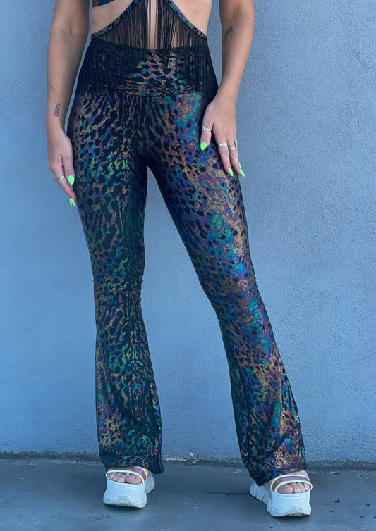 Radioactive print - iridescent black leopard print -  Unisex-Festival-outfit-rave-outfit - handmade-in-Brooklyn-New York City-custom made-waste conscious-groovy bellbottoms – retro style – hippie fashion - on model - front view