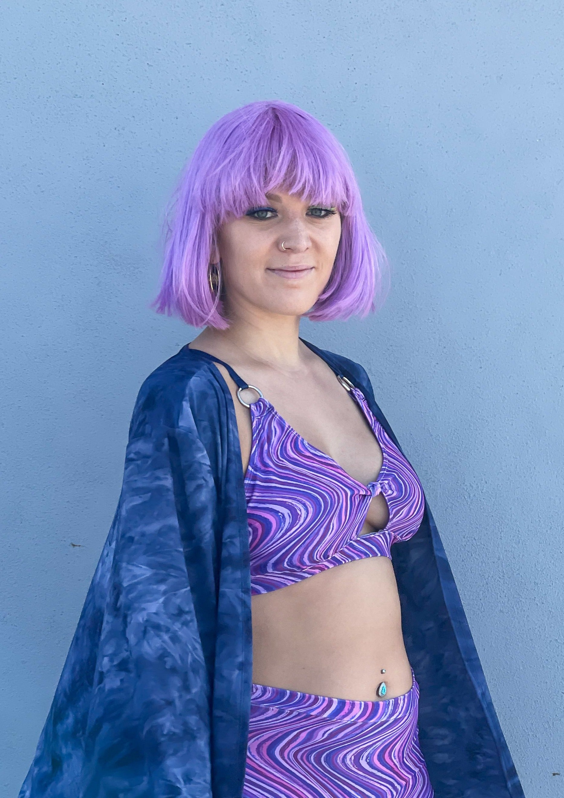 Womens music fesival fashion - Festival-outfit-rave-outfit - handmade-in-Brooklyn-New York City-custom made-waste conscious– retro style – hippie fashion – Knot Front Bra Top – front knot – rave bralette top – festival top - purple retro print - side view on model